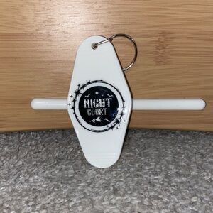 NWOT White Night Court Hotel Keychain